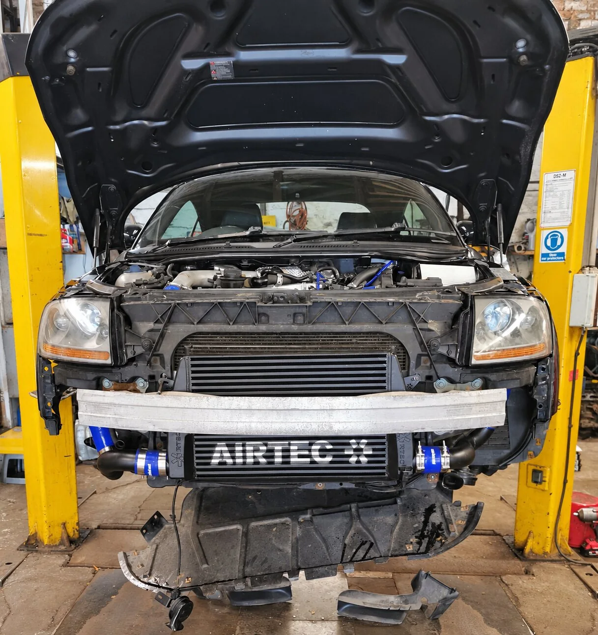 AIRTEC-branded intercooler on an Audi TT with the bumper removed