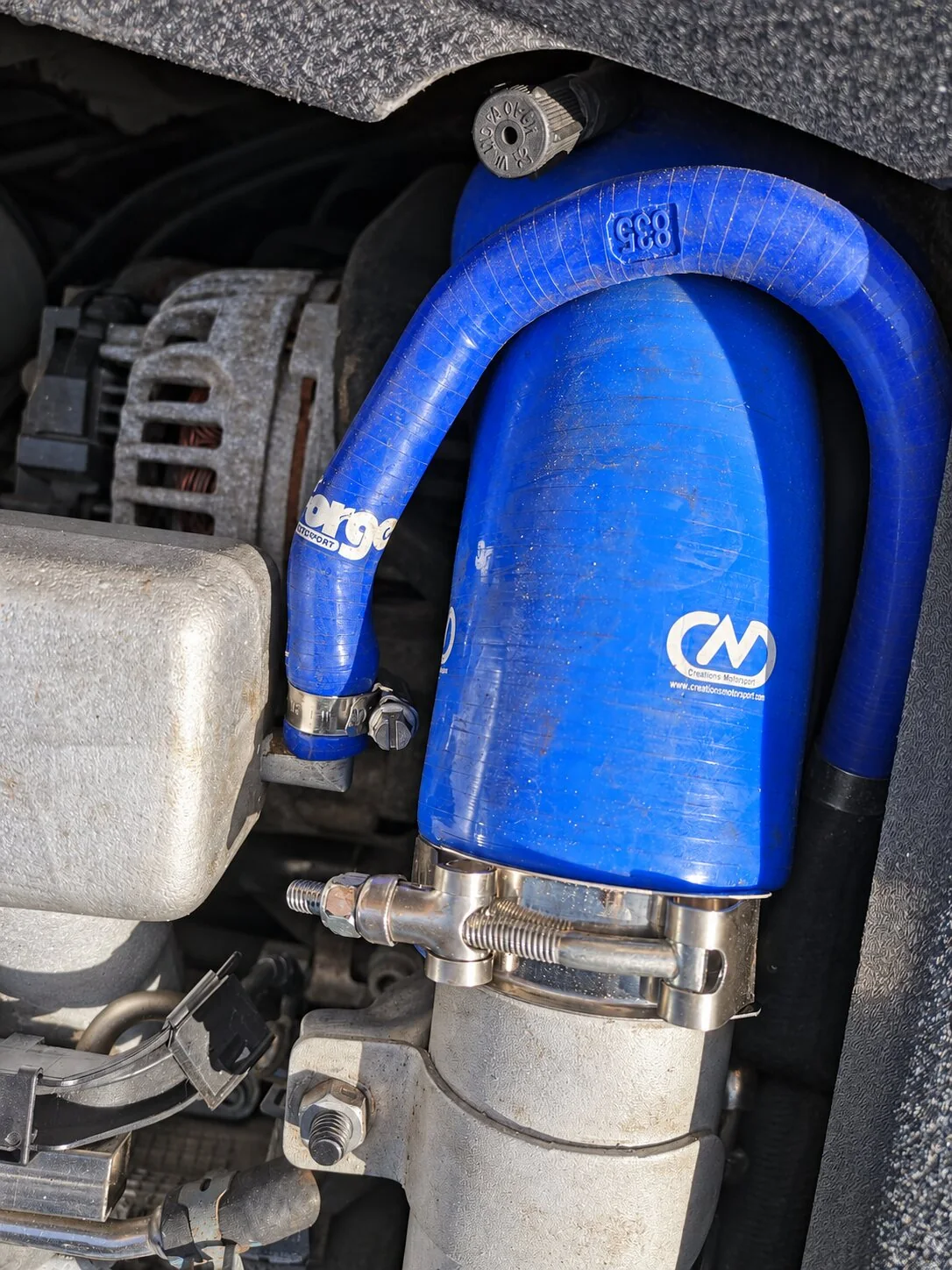 Blue silicone intake hoses and metal hose clamps