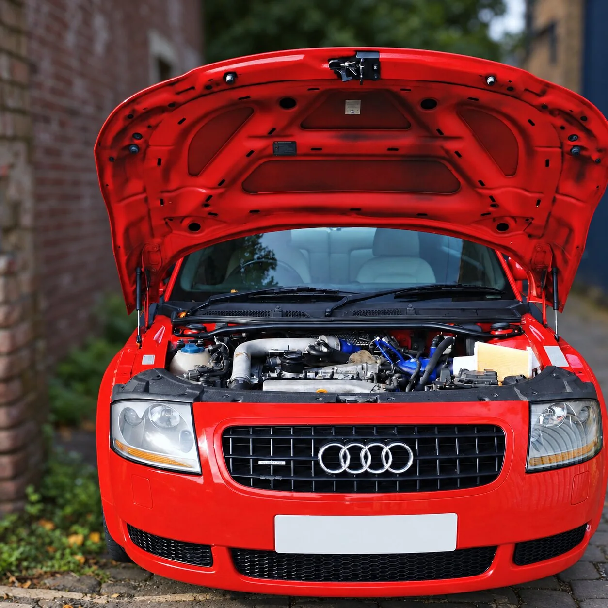 Red Audi TT with the bonnet open